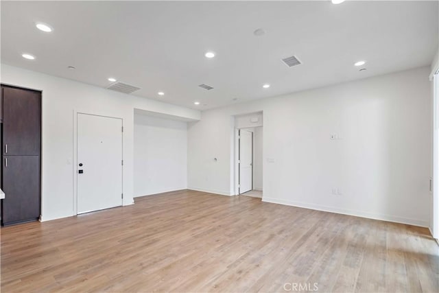 unfurnished room featuring light wood-type flooring