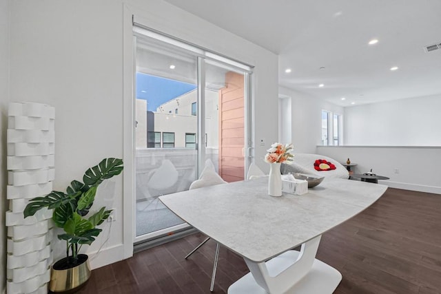 dining room with dark wood-type flooring