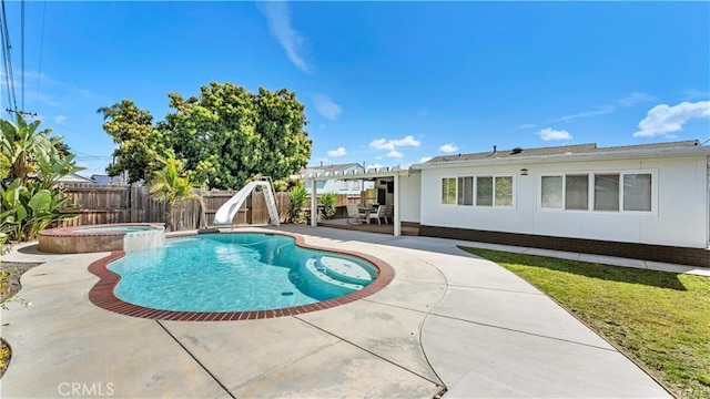 view of pool featuring an in ground hot tub, a patio, a water slide, and a pergola