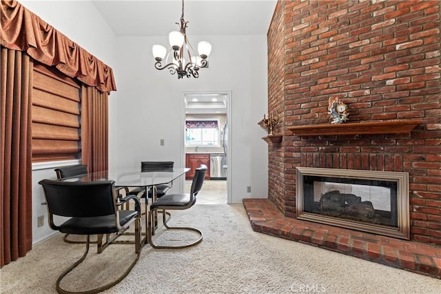 carpeted dining space featuring a chandelier and a brick fireplace