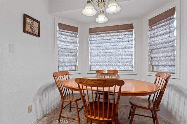 dining space with carpet floors