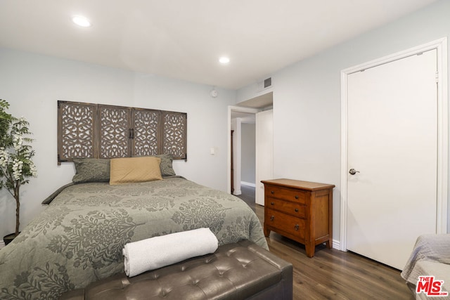 bedroom featuring dark hardwood / wood-style flooring