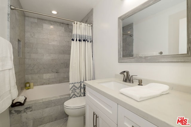 full bathroom with toilet, vanity, and shower / bath combination with curtain