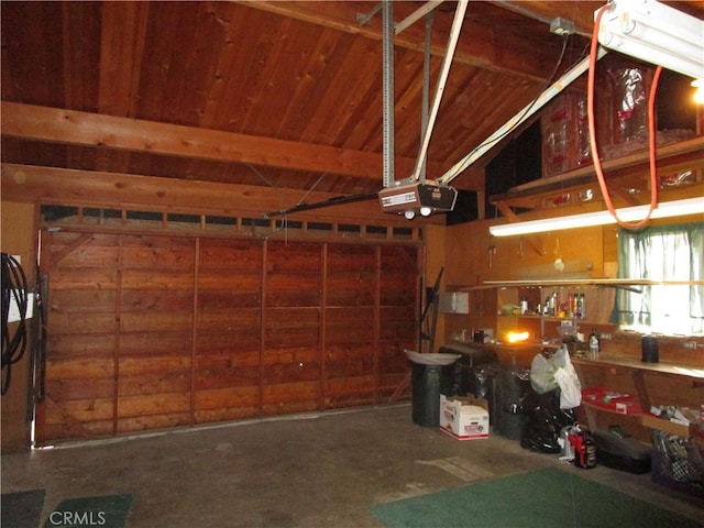 2440 Spruce Dr, Arrowbear, CA 92382 - garage featuring a garage door opener