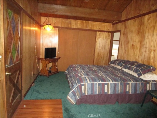 2440 Spruce Dr, Arrowbear, CA 92382 - carpeted bedroom with wooden walls and a wooden ceiling with exposed beams