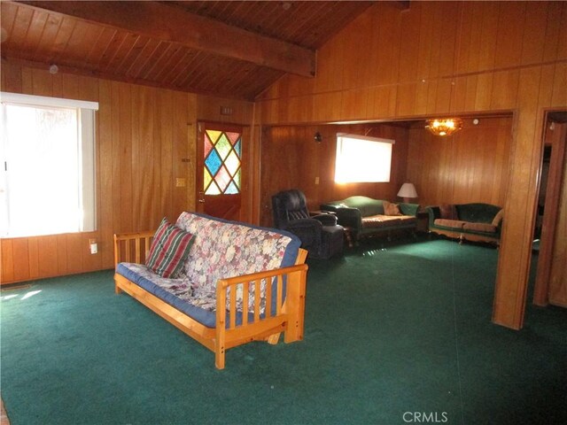 2440 Spruce Dr, Arrowbear, CA 92382 - living room with healthy amount of natural light, wood walls, wood ceiling, and carpet flooring