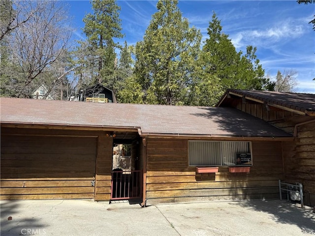 2440 Spruce Dr, Arrowbear, CA 92382 - view of front facade with an attached garage and a shingled roof