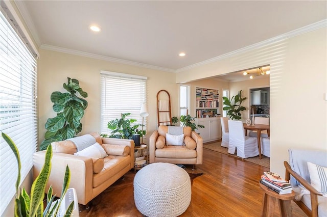 living room featuring wood-type flooring and crown molding