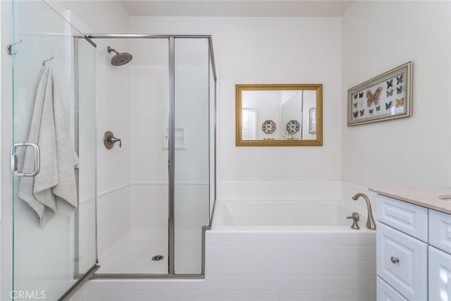 bathroom featuring vanity and separate shower and tub