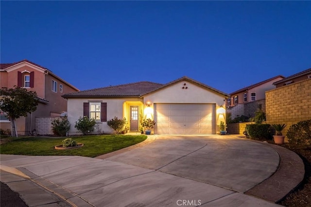 view of front of house with a garage and a front lawn