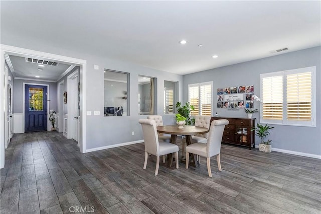 dining area featuring dark hardwood / wood-style flooring