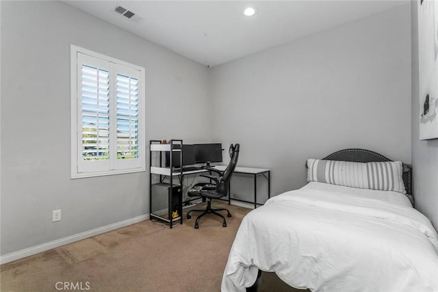 bedroom featuring light colored carpet