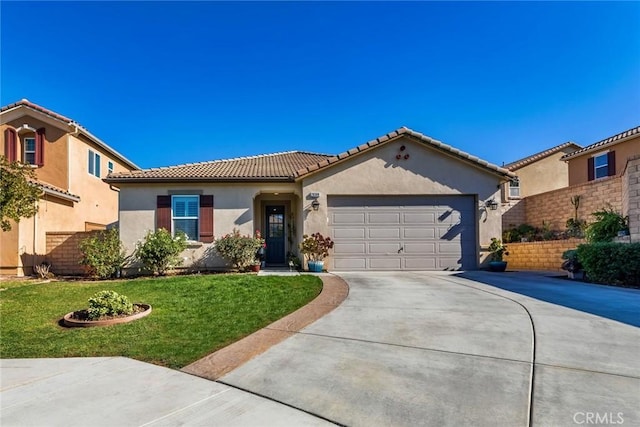 mediterranean / spanish-style home featuring a garage and a front lawn