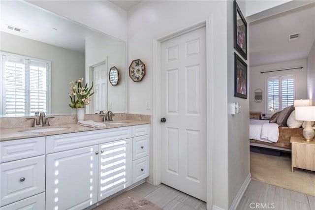 bathroom featuring tile patterned flooring and vanity