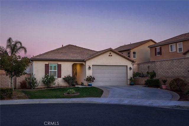 mediterranean / spanish-style house featuring a garage