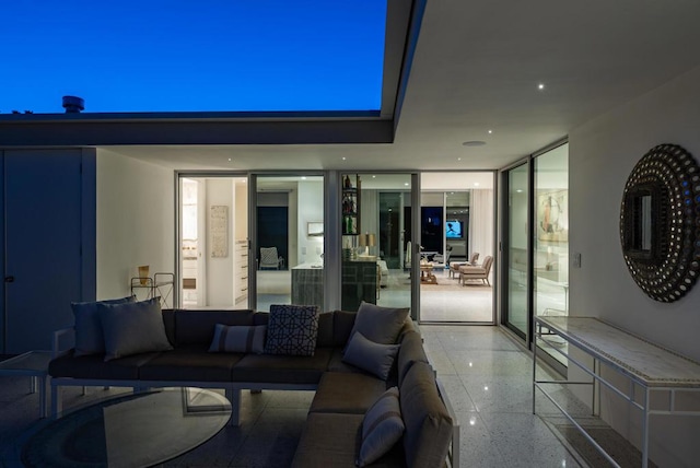 living room featuring a wall of windows