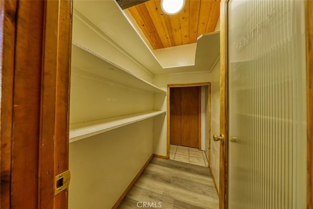 spacious closet with light hardwood / wood-style flooring