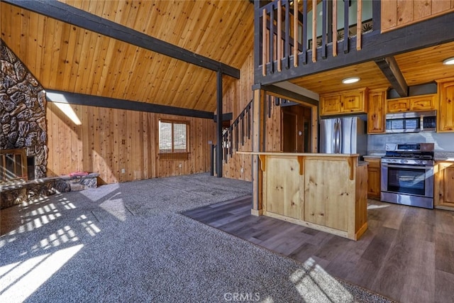 kitchen featuring wood ceiling, appliances with stainless steel finishes, high vaulted ceiling, and beamed ceiling