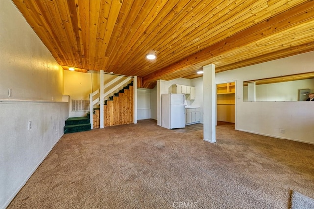 basement with white refrigerator, light carpet, and wood ceiling