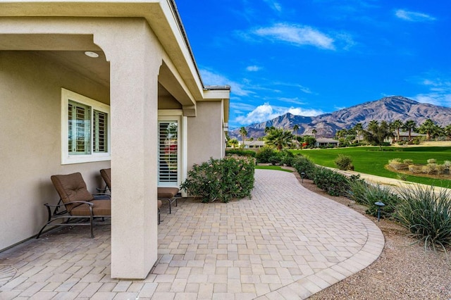 view of patio / terrace with a mountain view