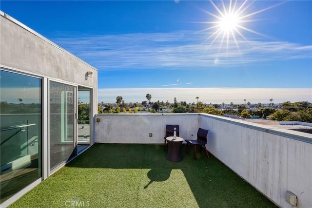 view of yard featuring a balcony