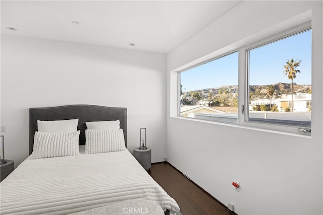 bedroom featuring dark wood-type flooring