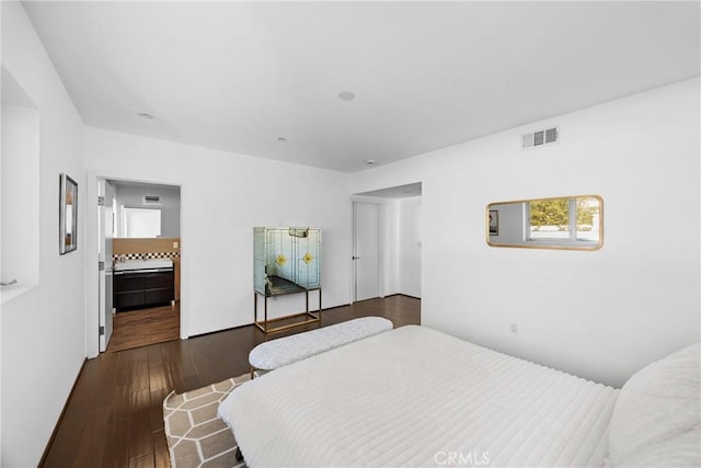 bedroom featuring dark hardwood / wood-style flooring