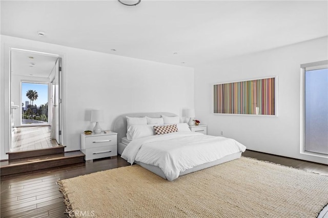 bedroom featuring dark hardwood / wood-style flooring