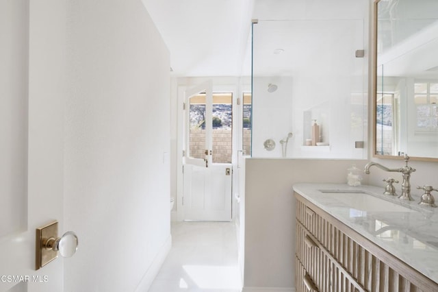 bathroom with vanity and a wealth of natural light