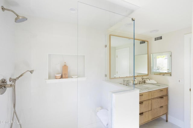 bathroom featuring vanity and walk in shower