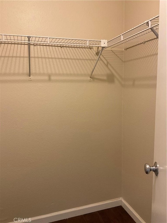 7405 Charmant Dr Unit 2320, San Diego, CA 92122 - spacious closet featuring dark wood-type flooring