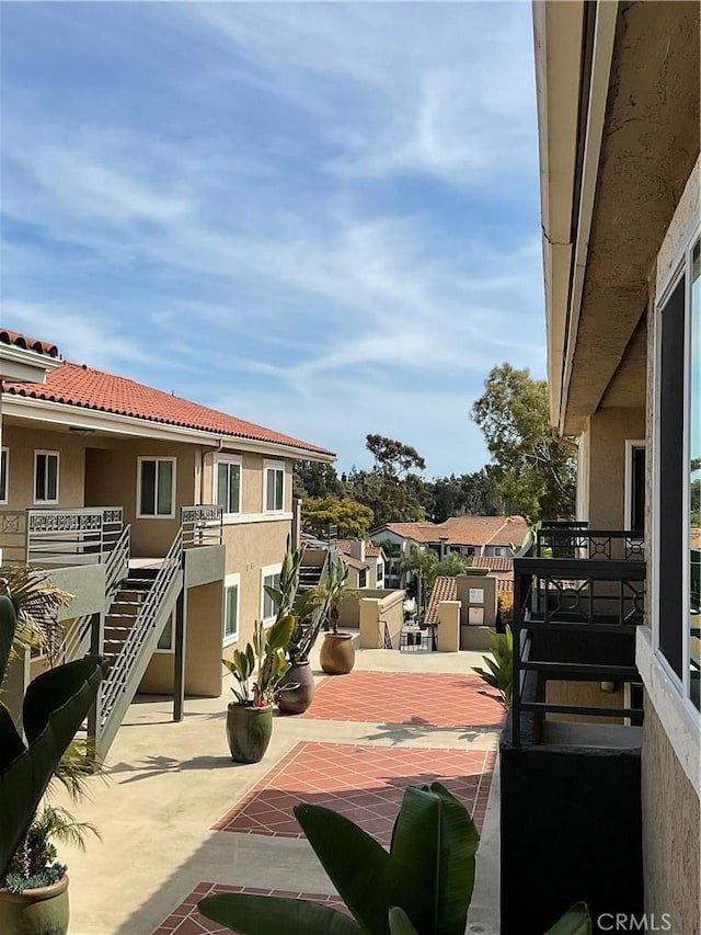 7405 Charmant Dr Unit 2320, San Diego, CA 92122 - view of patio / terrace featuring a residential view and stairs