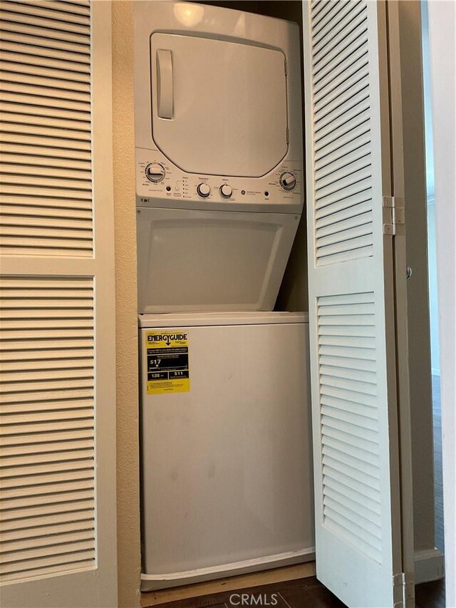 7405 Charmant Dr Unit 2320, San Diego, CA 92122 - laundry area featuring stacked washer / dryer and a heating unit