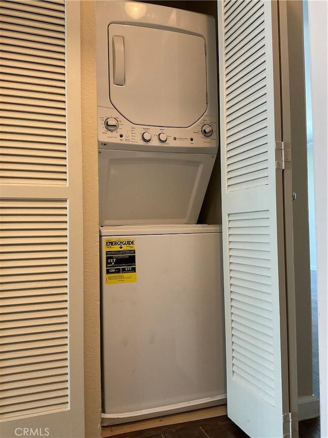 7405 Charmant Dr Unit 2320, San Diego, CA 92122 - washroom featuring estacked washer and dryer and a heating unit