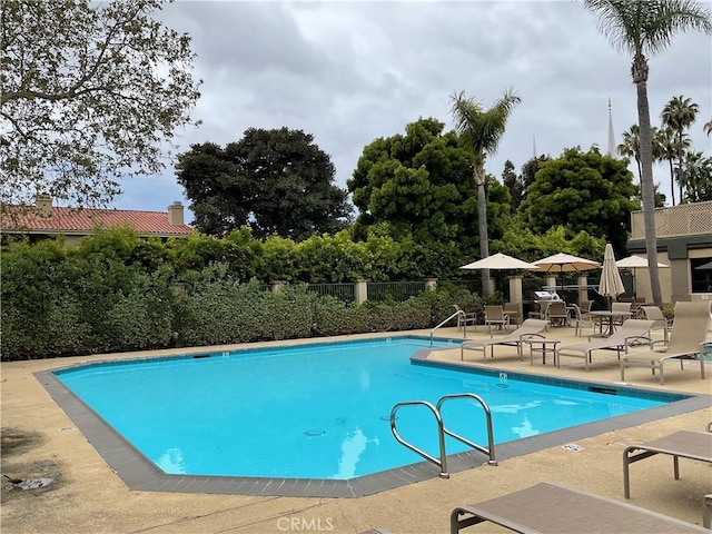 7405 Charmant Dr Unit 2320, San Diego, CA 92122 - community pool with a patio area and fence
