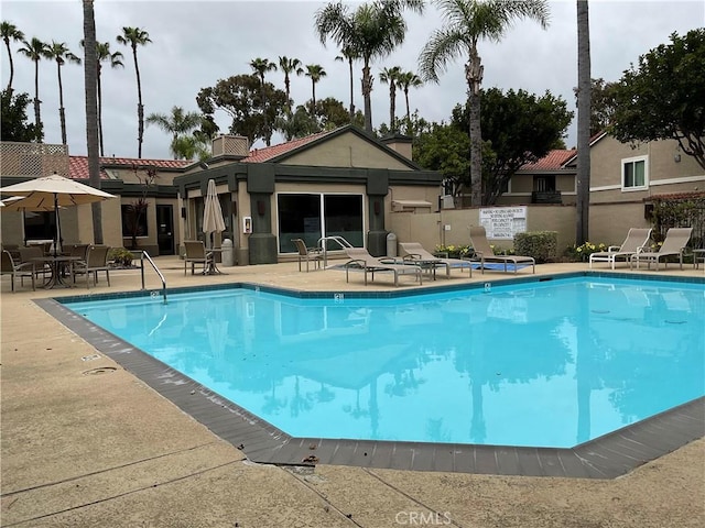 7405 Charmant Dr Unit 2320, San Diego, CA 92122 - community pool featuring a patio and fence