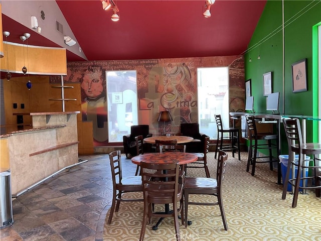 7405 Charmant Dr Unit 2320, San Diego, CA 92122 - dining area with stone finish flooring and high vaulted ceiling