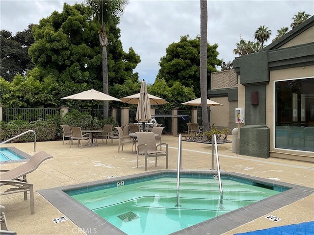 7405 Charmant Dr Unit 2320, San Diego, CA 92122 - view of pool with a community hot tub, fence, and a patio