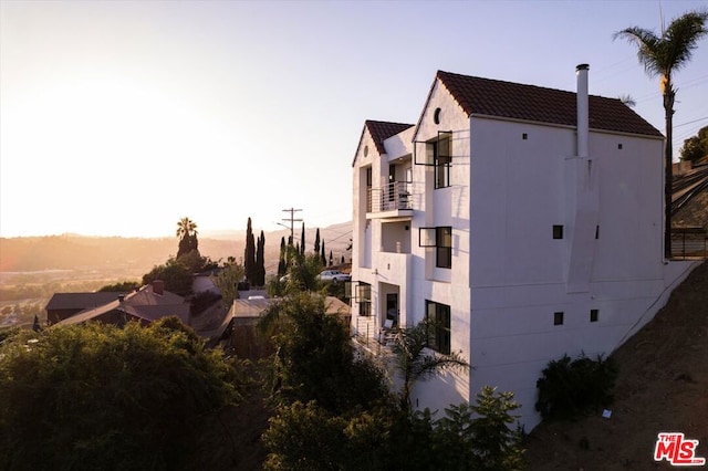 view of outdoor building at dusk