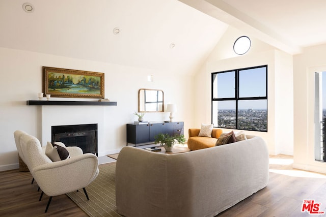 living room featuring hardwood / wood-style flooring and lofted ceiling with beams