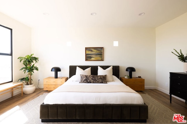 bedroom featuring hardwood / wood-style flooring