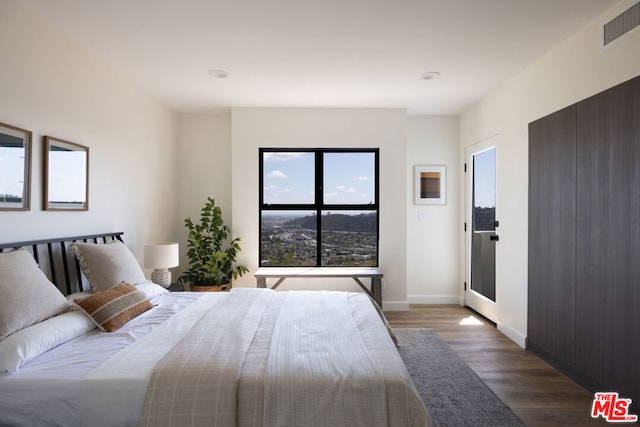 bedroom featuring wood-type flooring