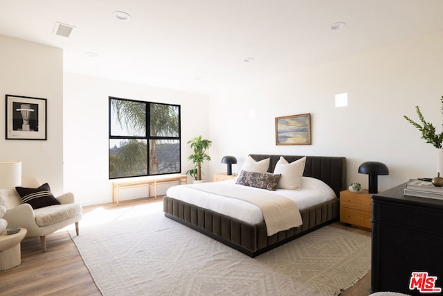 bedroom with light wood-type flooring