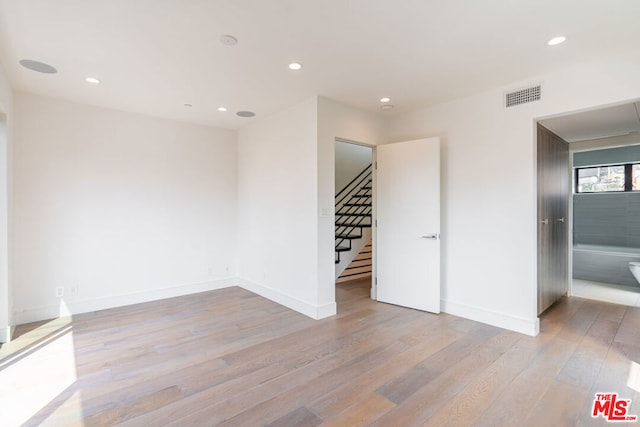 unfurnished room featuring light hardwood / wood-style flooring