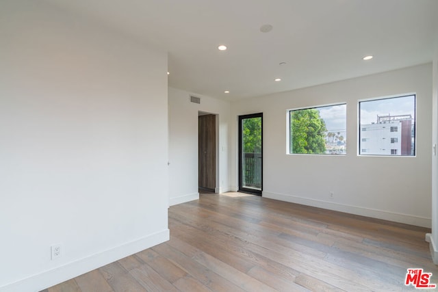 empty room featuring light hardwood / wood-style floors