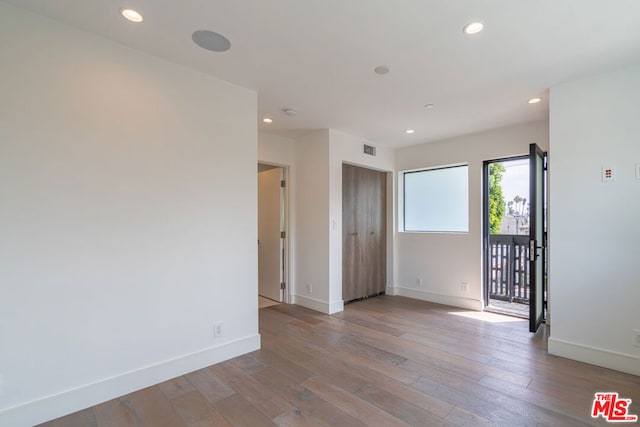 unfurnished room featuring light hardwood / wood-style flooring