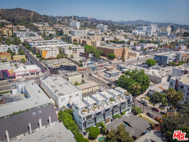 birds eye view of property featuring a mountain view