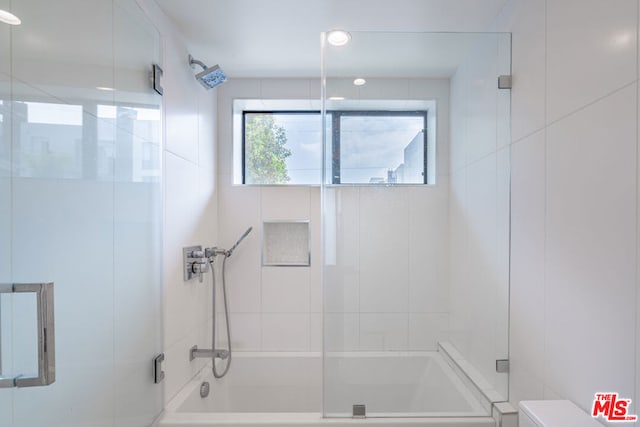 bathroom featuring enclosed tub / shower combo