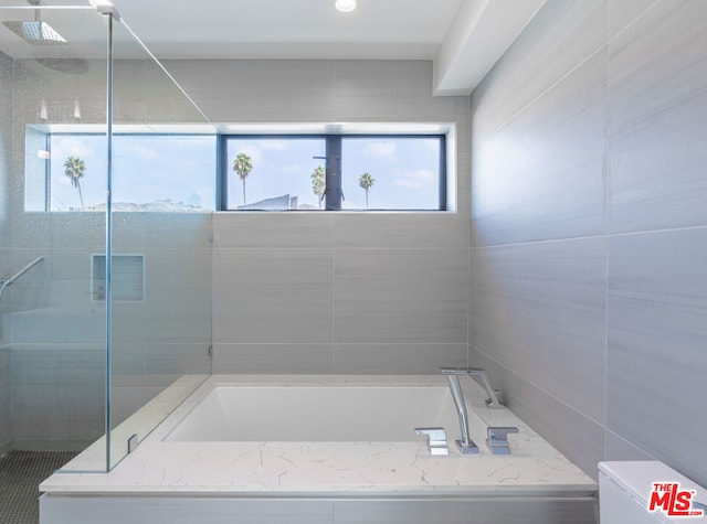 bathroom with independent shower and bath