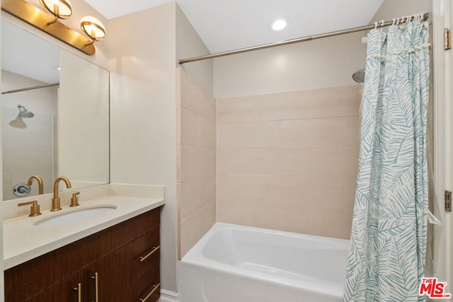 bathroom with vanity and shower / tub combo